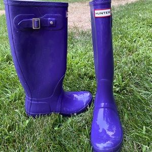 Purple glossy hunter rain boots.